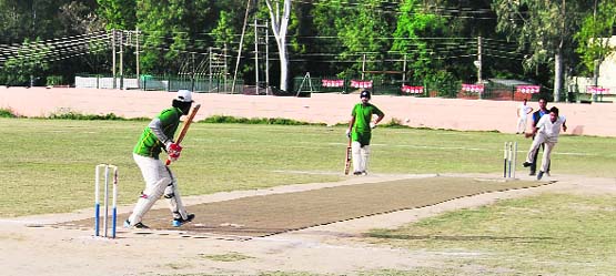 Players of KCC and MCC in action during a match on Monday at Sports Stadium, Reasi. 