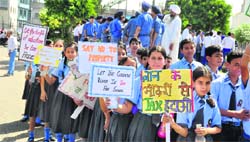 Students of private schools hold a protest against the property tax in Ludhiana on Monday.