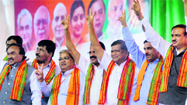 Karnataka BJP MP Ananth Kumar (R) and Chief Minister Jagadish Shettar (3R) with other party leaders during a rally in Bangalore on Monday.