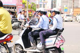 Point made: Members of the Women Armed Special Protection Squad (WASPS) have started wearing helmets after Bathinda Tribune pointed out that they were flouting traffic rules while patrolling the city
