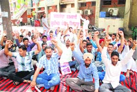 MGNREGA workers staging a protest outside the office of Zila Parisad in Bathinda on Tuesday