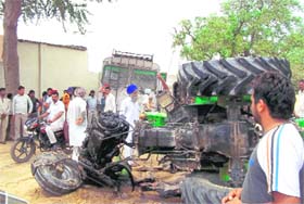 The mangled remains of the tractor that collided with a bus near Mandi Kalan village in Rampura on Tuesday