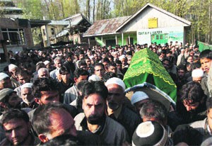 People carry the coffin of Kolipora village sarpanch Ghulam Mohammad Lone in Pulwama district on Tuesday. Lone was killed by suspected militants outside his home on Monday night. 