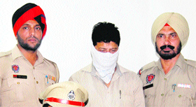 Sarwan Kumar, accused of forging documents related to property, arrested by the police in Jalandhar on Tuesday.