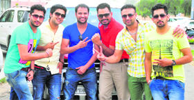 Actor-cum-singer Amrinder Gill with the star cast of Dady Cool Munde Fool on the PAU campus .