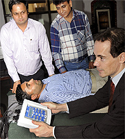 Emiel Spiessens (extreme right) demonstrates his art