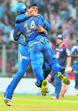 Displaying their new-found bonhomie as teammates, Bhajji and Punter brace each other after the fall of a Delhi wicket.