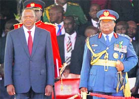 Kenyas President Uhuru Kenyatta (L) and Chief of Defence Forces General Julius Karangi after Kenyattas swearing-in ceremony at the Kasarani Stadium in Nairobi on Tuesday