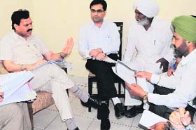 Raj Kumar Verka, Vice-Chairman, National SC/ST Commission, listens to the grievances of the victims of various cases in Amritsar on Wednesday