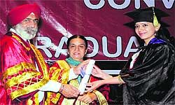 Vice-Chancellor, Baba Farid University, Dr SS Gill confers a degree on a graduate of the Adesh Medical Institute during a function held in Bathinda on Wednesday
