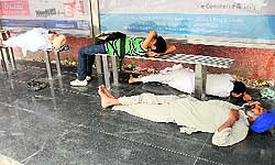A bus stand on Amrik Singh road in the city is used by these men to catch forty winks on Wednesday
