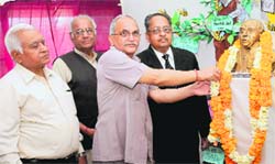 Dignitaries garland the statue of Dr Samuel Hahnemann at the Homoeopathic College and Hospital, Sector 26, in Chandigarh on Wednesday. Tribune photo: Manoj Mahajan