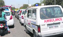An ambulance stuck in a traffic jam at the Sector 29/32 roundabout on Wednesday. Tribune photo: Manoj Mahajan