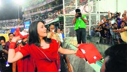 Preity Zinta, co-owner of Kings XI Punjab, throws T-shirts at fans at the PCA Stadium, Mohali, on Wednesday.