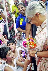 Delhi Chief Minister Sheila Dikshit seen with autistic children in a programme during the Autism Awareness Walk 2013 at India Gate in New Delhi on Wednesday