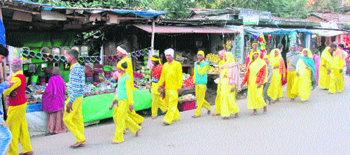 Yellow-clad pilgrims throng temple town of Kangra a day ahead of Chaitra Navratras on Wednesday. 