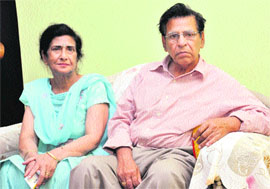 Maternal grandparents of Achintya, whose custody has been taken by the social service office in the UK, express their resentment at their residence in Jalandhar on Wednesday. 