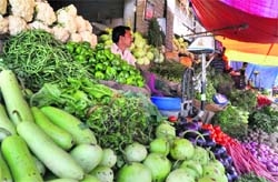 Soaring prices of fruits and vegetables are hitting the common mans pocket. Tribune photo: Anand Sharma