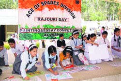 An essay-writing and painting competition under way at VVAP School in Rajouri on Wednesday. A Tribune photograph