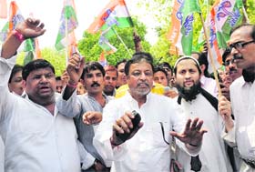 Trinamool Congress leader Mukul Roy along with party activists hold a protest in New Delhi on Wednesday