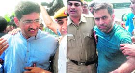 Lawyer Baljeet (left) and realtor Deepak Bhardwajs son Nitesh being produced in the Patiala House court in New Delhi on Wednesday