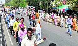 Members of MGNREGA Karamchari Union stage a protest in Bathinda on Thursday