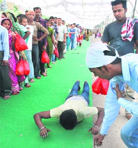 A man crawls to the shrine in Panchkula on Thursday