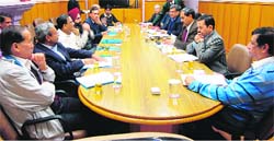 Uttarakhand Chief Secretary Alok Kumar Jain and Himachal Chief secretary Sudripta Roy hold talks on the Kishau hydroelectric project in Shimla on Thursday.