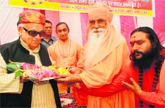 Governor Aziz Qureshi being greeted on his artrival at Juna Akhara in Haridwar on Wednesday. 