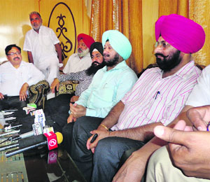 SP Singh Oberoi (2nd from right) addresses a press conference in Kaithal on Thursday. 