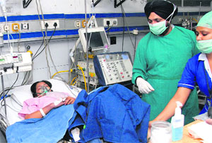  woman who fell ill after consuming the lunch at Chinar Forge Ltd canteen undergoing treatement at a private hospital in Jalandhar on Thursday. 