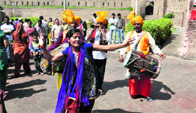 Celebrate by dancing to the beat of the dhol of first Navratra in jammu on Thursday.
