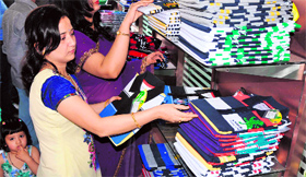 Women select garments at a newly opened showroom in Jammu on Thursday.