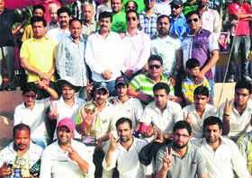 Members of NCC and KCC cricket teams pose for a photograph with the chief guest at Sports Stadium in Reasi on Thursday.