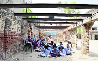 Students at Government Primary School, Field Ganj, study in a roofless dilapidated building at Shaheed Sukhdev Thapar Government School, Bharat Nagar Chowk, in poor shape.
