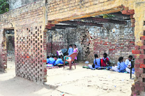 Students study in a dilapidated building at Government Primary School, Field Ganj