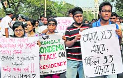 SFI activists take out a silent march at Presidency College in Kolkata on Thursday.  PTI