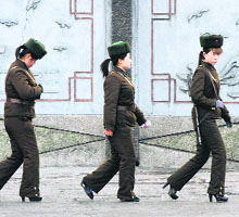 North Korean women soldiers patrol along the banks of Yalu River near Sinuiju town, opposite the Chinese border city of Dandong, on Thursday