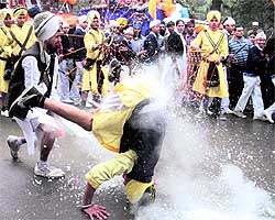 Youths perform gatka in Amritsar on Friday