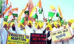 Members of the All-India Terrorist Front raise slogans in support of Jallianwala Bagh massacre victims in Amritsar on Friday