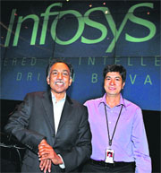 Infosys CEO & MD S.D. Shibulal (L) with CFO Rajiv Bansal during the announcement of the companys annual results in Bangalore on Friday.