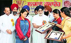 Education Minister Sikandar Singh Maluka felicitating students who won awards at various national-level sporting events, at the St Xaviers School in Bathinda on Friday