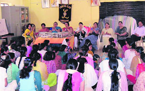 Members of the Lioness Club of Mussoorie address a gathering at an old-age ashram in Dehradun on Friday.