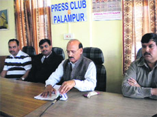 BJP legislator Ravinder Singh Ravi addresses a press conference at Palampur on Friday.