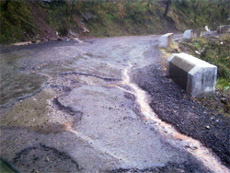 A stretch of the Sanawar-Dharampur road which has worn off even before completion of the repair work.