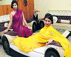 Models display the newly- launched summer collection of furniture at Glass Palace