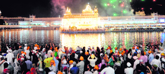Fireworks add to the grandeur of the illuminated Golden Temple on Baisakhi in Amritsar.