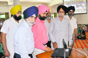 Members of Gurdwara Sri Guru Singh Sabha, Sector 19-D, Chandigarh, during the launch of the website.