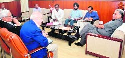 Chief Minister Vijay Bahuguna holds a meeting with officials of the Indian Institute of Management- Kashipur in Dehradun on Saturday. 