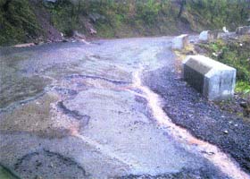A stretch of the Sanawar-Dharampur road which has worn off even before completion of repair work